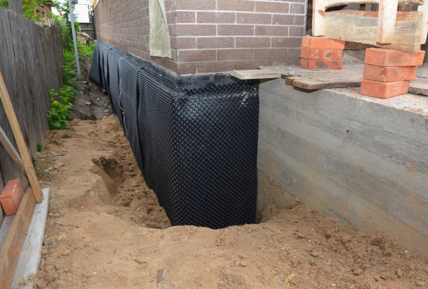 Happy homeowners after waterproofing job in Huntly